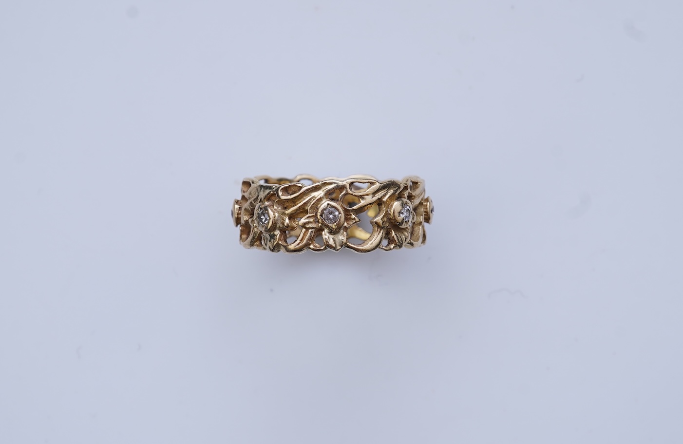 A gold and diamond eternity ring